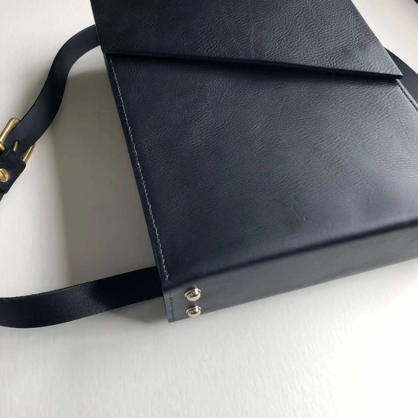 Pioneer Black Leather Laptop Backpack with minimalist design and adjustable strap.