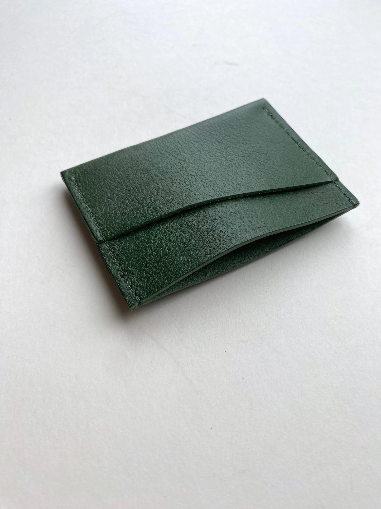 Green leather card holder wallet by CARV in minimalist design