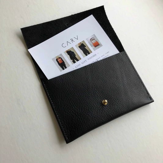 Leather gift voucher in handcrafted black leather pouch by CARV.