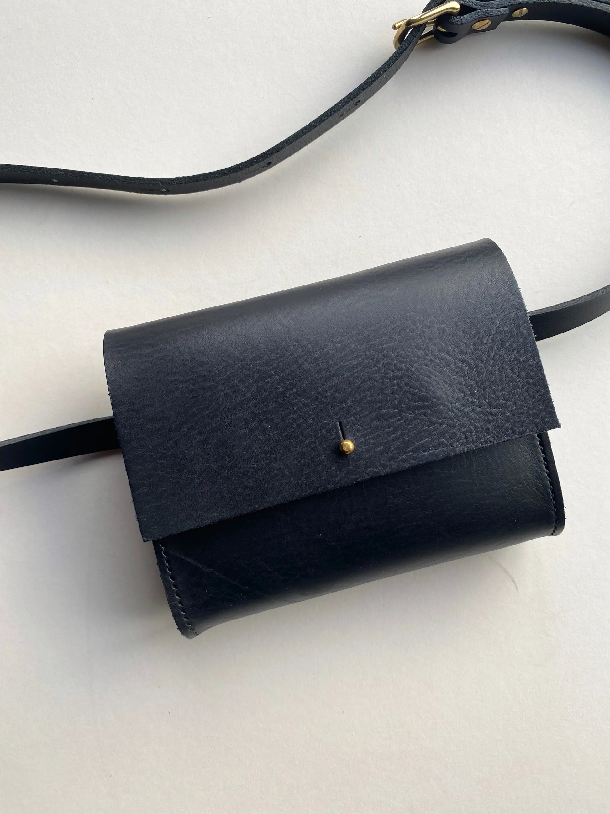 Textured black leather bum bag by CARV with button stud detail